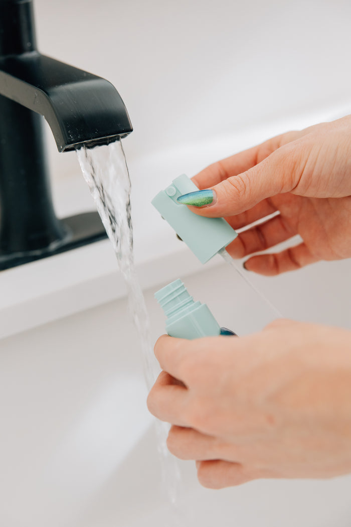 Filling the spritzer with tap water